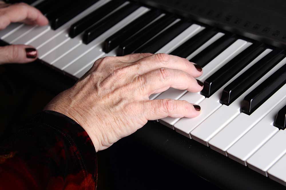Mary Ellen plays music for hospice paitents